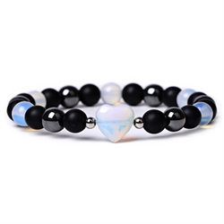 Armbånd af hæmatit, opal og abrazin sten. Elastisk. 19 cm