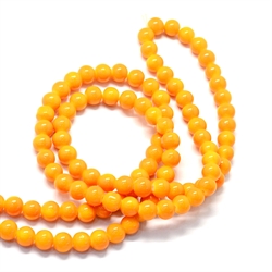 Glasperler i orange nuancer. 10 mm streng