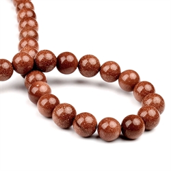Goldstone perler. 6 mm. 1 streng